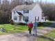 Close up of the William Silas Minter house located just north of Leatherwood in Henry Co., Va. where Leatherwood Creek flows under Rte 57.  Mary Lou Hagen and Desmond Kenrick, Archivist of Henry Co., stand in the driveway.
